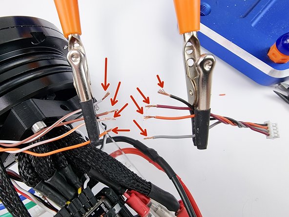 Strip the insulation from the end of the wires to prepare them for soldering