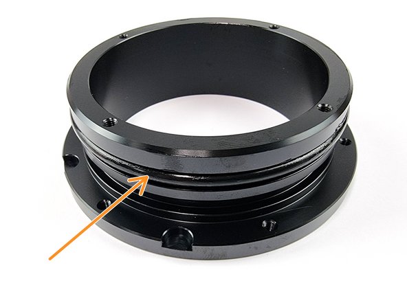 Install one of the o-rings into the first groove of the flange.