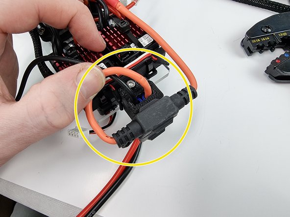 The fuse holder will sit at the end of the support plate as shown. If you want you can cable tie it in place if you like.