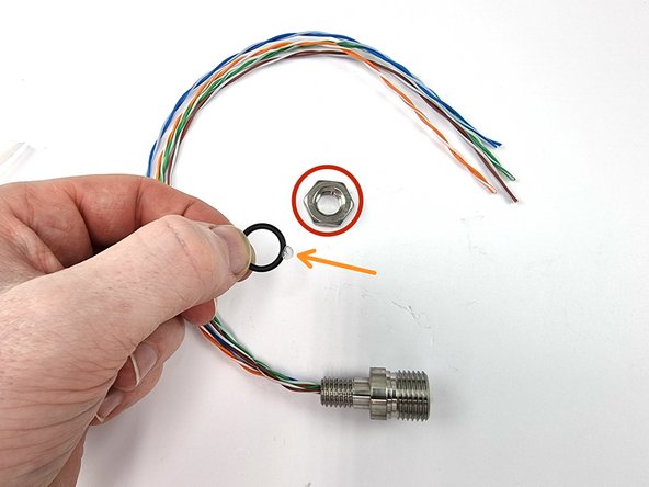 Remove the nut and the o-ring from the bulkhead connector
