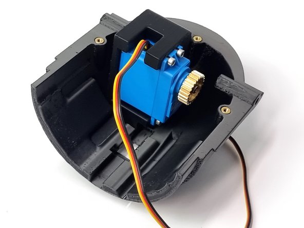 Ensure the servo is mounted into the servo mount before installing it.