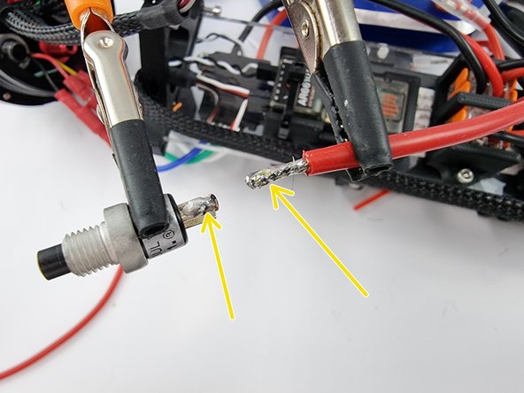 Secure the switch and the wire in place and tin the end of the wire and the tab of the power switch.