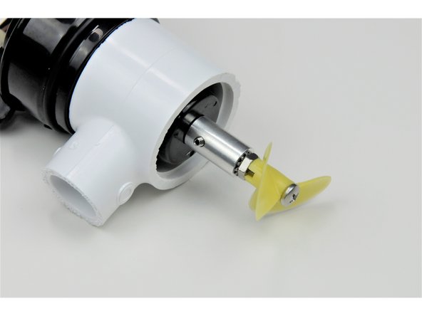 Install the propeller adapter over the shaft of the motor, lining up the set screw with the flat part of the motor shaft.