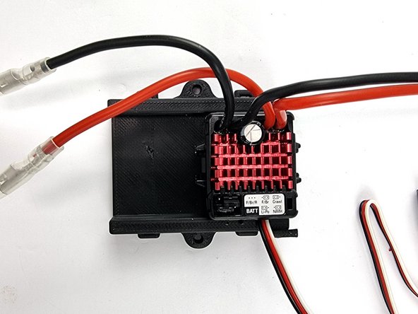 Grab the ESC Mount that you have 3D Printed. Both the ESC's will be mounted into this.