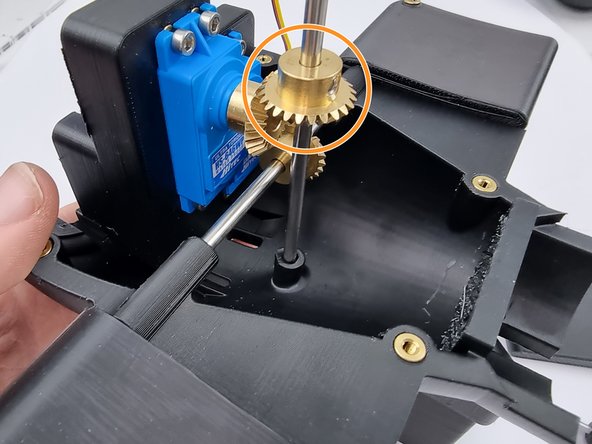 Slide the 4mm Bevel gear onto the control rod.