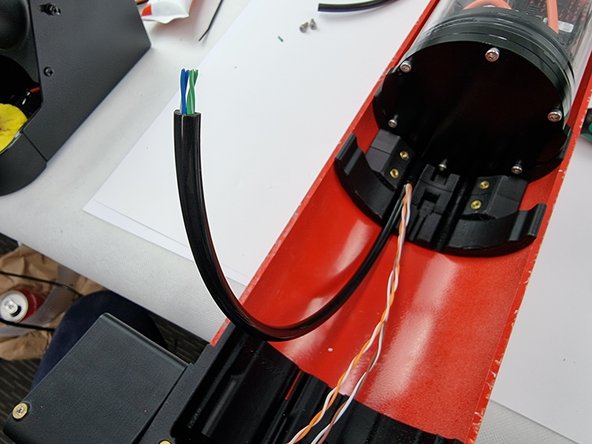 Trim the cable cover to length and slide it over the wires for the fore servo which are the blue,blue/white,green and green/white wires.