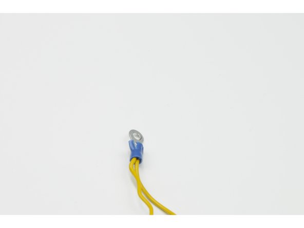 Take two of the 8 cm lengths of wire, set them side by side, and twist one pair of stripped ends together.