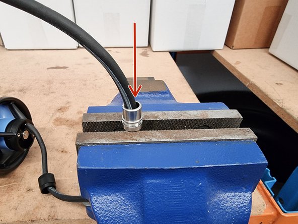 Place the connector shell into a vice.