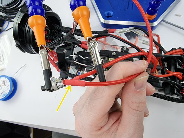 Before soldering them together cut a strip of heat shrink and slide over the wire