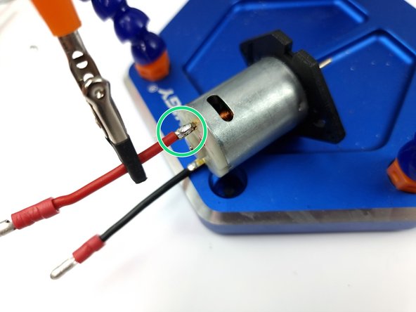 There is a red dot on the back of the pump that is the positive terminal that we solder the red wire to.