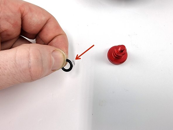 Lubricate the 2 small O-rings with silicone grease