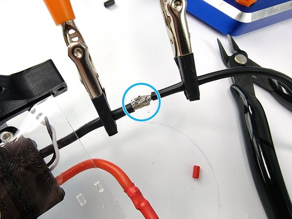 Tin the 2 ends of the wires with solder to prepare them to be soldered togther.