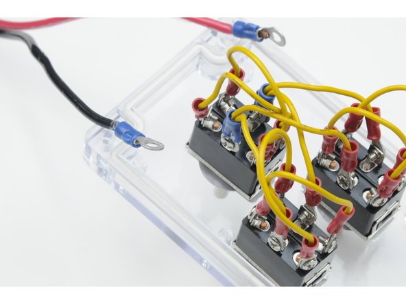 Carefully unscrew the centre, left post on the same switch. This post should have the other power jumper wire attached.