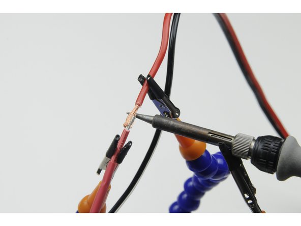 Twist the exposed wires together, forming a temporary joint that is as straight and smooth as practical. (No wires sticking off at an angle)