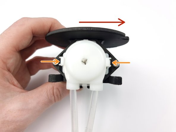 We need to rotate the head of the pump so the tubes come out on the righthand side