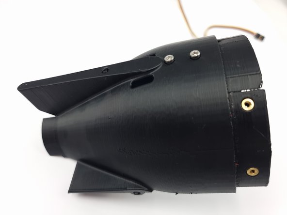 Once in place turn the cap upside down while holding it in place and insert the 2 screws to fix it into place