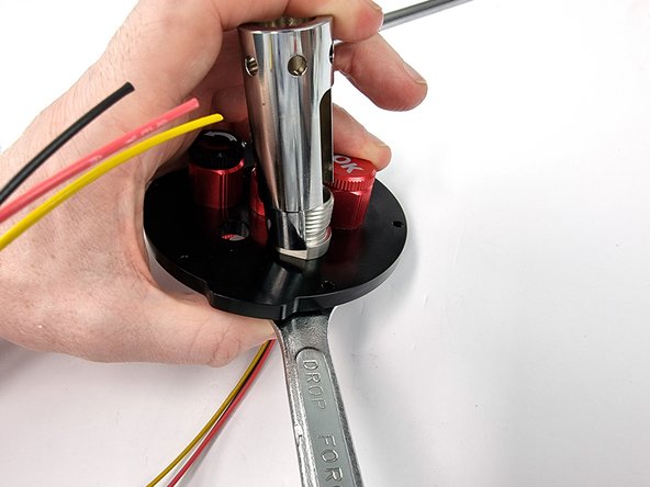 Install the nut on the back side of the bulkhead connector and tighten with the penetrator wrench and a 17mm spanner