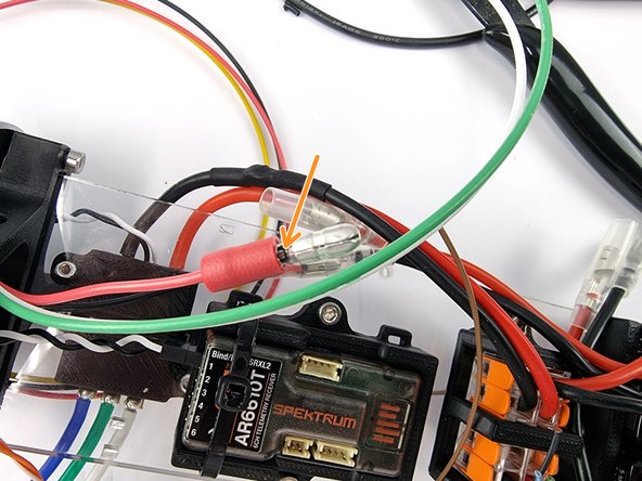 Slide a male bullet connector onto the wire ensuring the wire reaches the stop in the bullet connector.