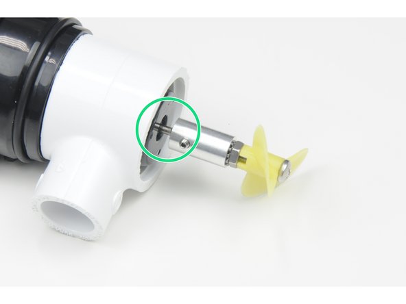 Install the propeller adapter over the shaft of the motor, lining up the set screw with the flat part of the motor shaft.