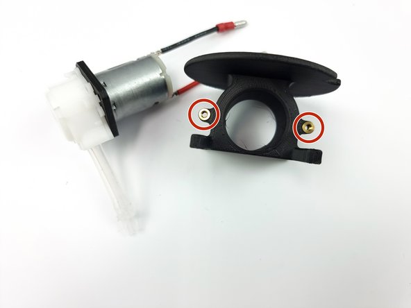 Prepare the peristaltic pump mount and install the threaded insert if they haven't been inserted already.