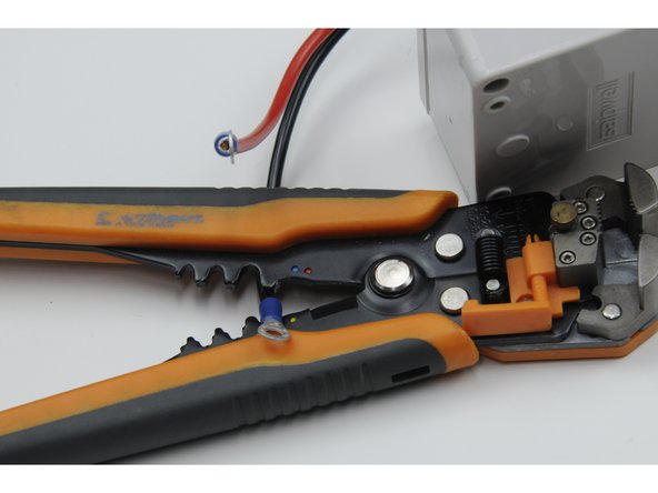 Crimp a blue ring terminal over the end of both the red wire and black wire.