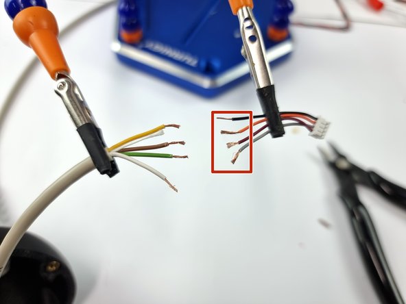 On the end of the 4 core wire that is in the buoy, strip the outer insulation as well as the insulation from the end of each wire.