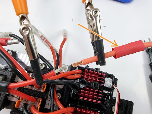 Secure the end of the wire from the power switch and the end of the wire from the fuse holder