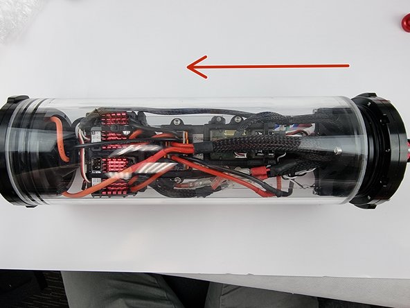 Carefully slide the support plate with the components into the acrylic tube. Watch that you don't catch any wires as you insert it.
