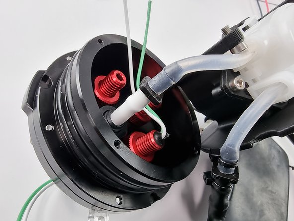 Push the silicone tubing from the intake side of the peristaltic pump