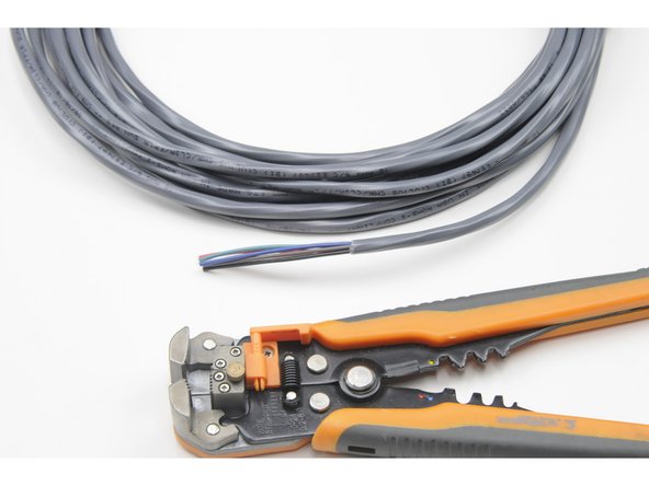 Do not nick any of the six coloured wires inside. If you do, cut the tether cable where you nicked an inside wire and start again.