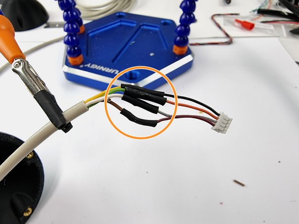 Apply heat to shrink it into place protecting the joints to ensure they don't short out with each other.