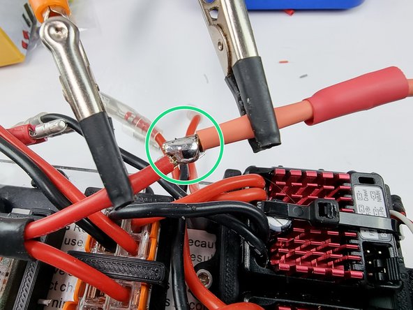 Tin the ends of the wires with solder to prepare them to be soldered together.