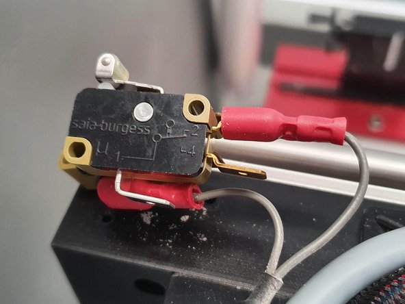 Connect the new limit switch to the first connector you remove before removing the second to ensure you connect them to the correct place.