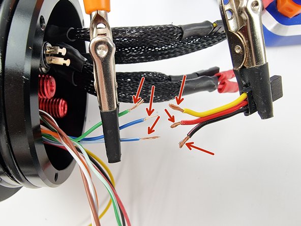 Strip the end of the wires to prepare them for soldering.