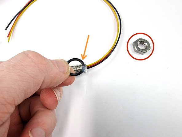 Remove the nut and the o-ring from the bulkhead connector