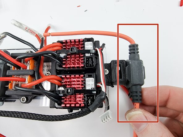The fuse holder will sit at the end of the support plate as shown.