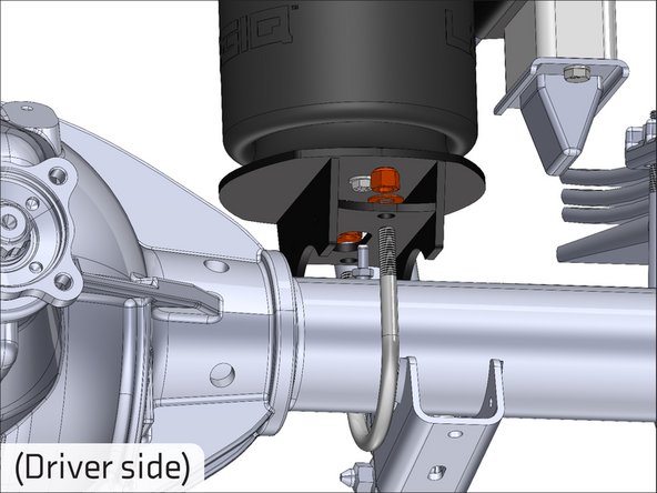 Attach the lower bracket to the axle using the supplied U-bolt, washers and nuts.