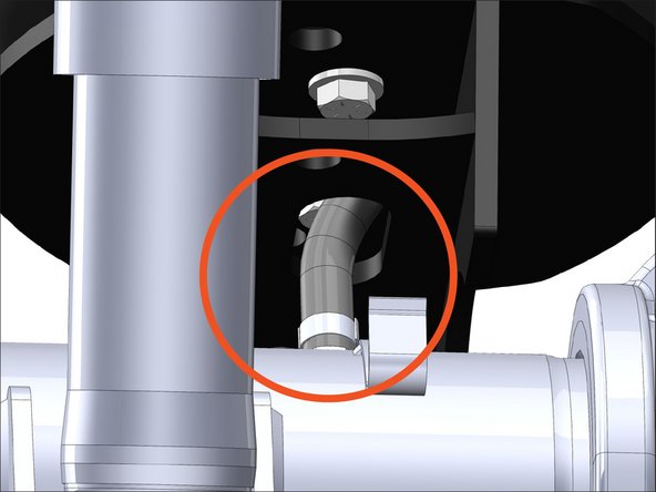 Route the breather line through the slot in the middle of the driver side lower bracket.