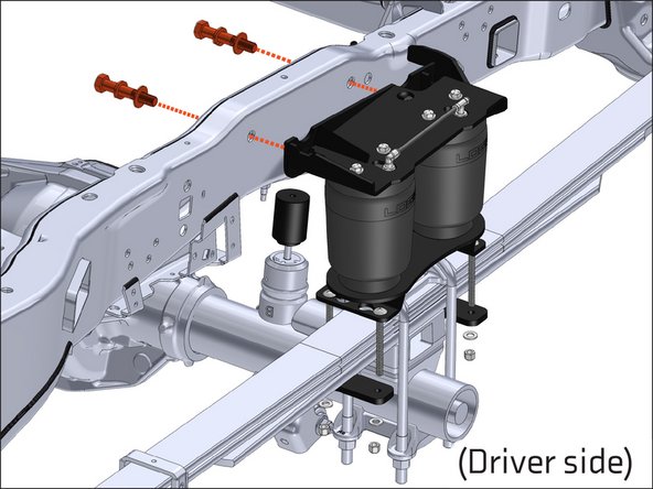 Use the supplied 3.5" long Grade 8 5/8" bolts, with split washers and flat washers, to attach the upper air spring bracket to the outside of the frame, through the factory sleeved holes. Snug hardware.