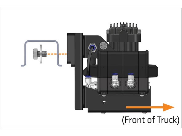 The cross-member can be located by the brake line bracket attached to it.