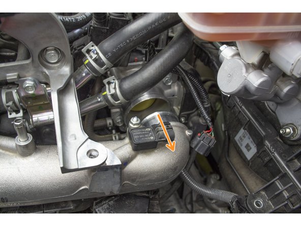 Alternatively if you don't have a long enough extension then you can use a long Philips head screw driver