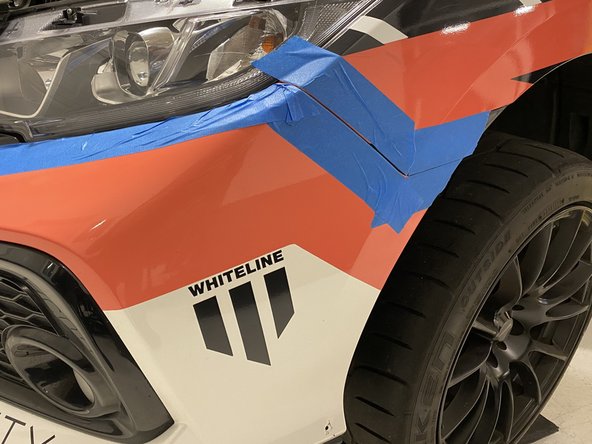 Now is a good time to apply tape to protect your paint from scratches during bumper removal and install