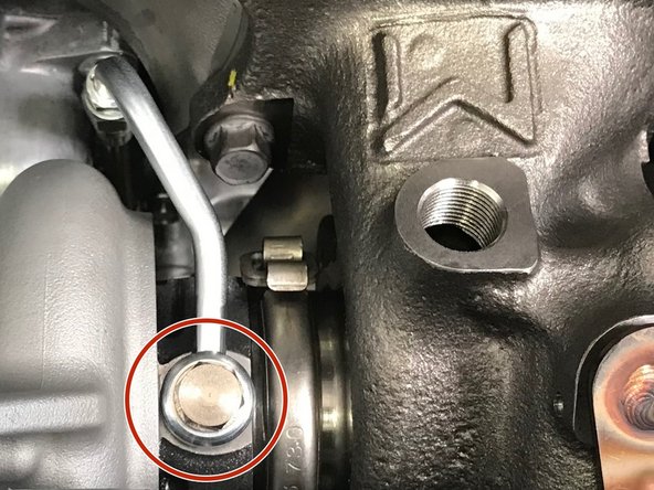 Use a 14mm socket and torque the oil feed banjo bolt to 12-14 ft-lbs