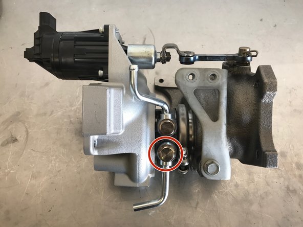 Install the lower coolant pipe on the turbo as shown.  Torque to 21-24 ft-lbs