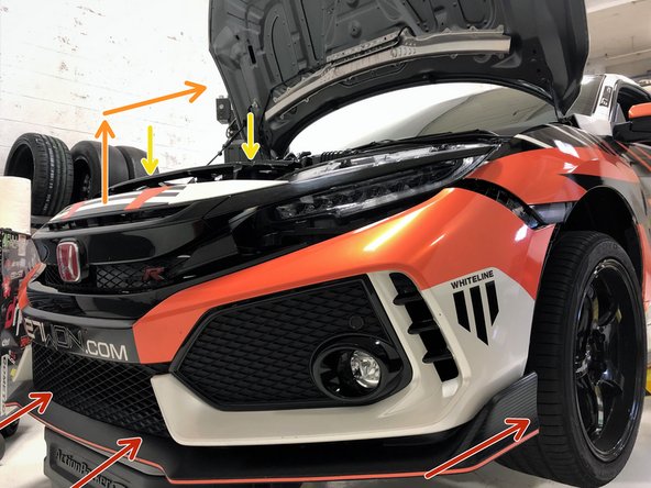 Start by lifting the bottom edge of the bumper into position first