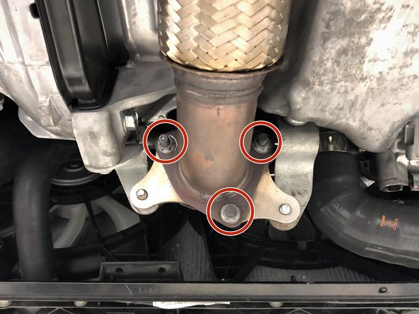 Install the three provided M10x1.50 studs into the downpipe outlet flange as shown