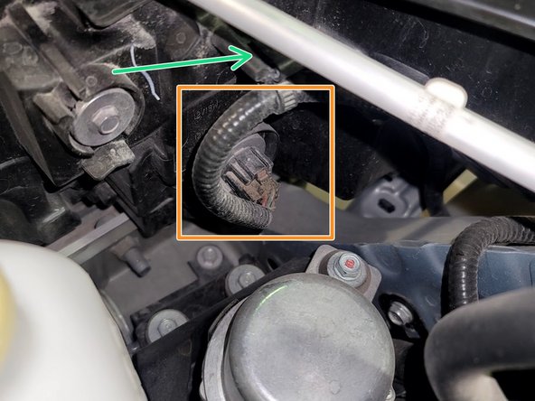 Unplug Headlight by pinching plug and pulling it out