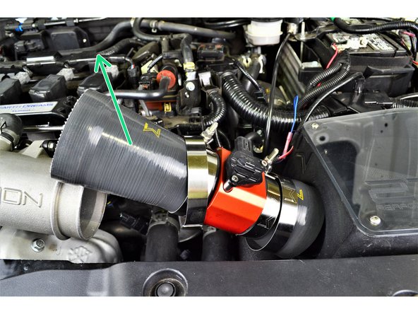 Use a 10mm wrench or socket and ratchet to loosen the 86-94mm clamp on the airbox