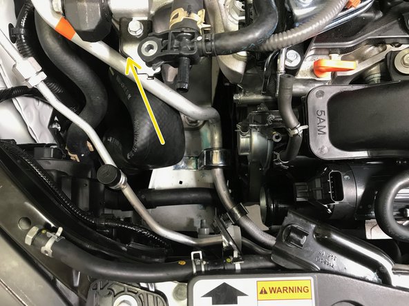 Pull the hose off the TIP in the direction of the arrow