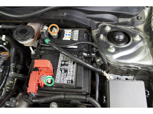 Loosen the nut with a 10mm deep socket and ratchet then remove the Negative cable from the battery.  Tuck the cable out of the way